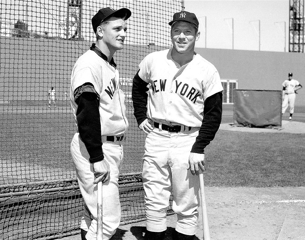 New York Yankees Roger Maris, left, and Mickey Mantle wait their