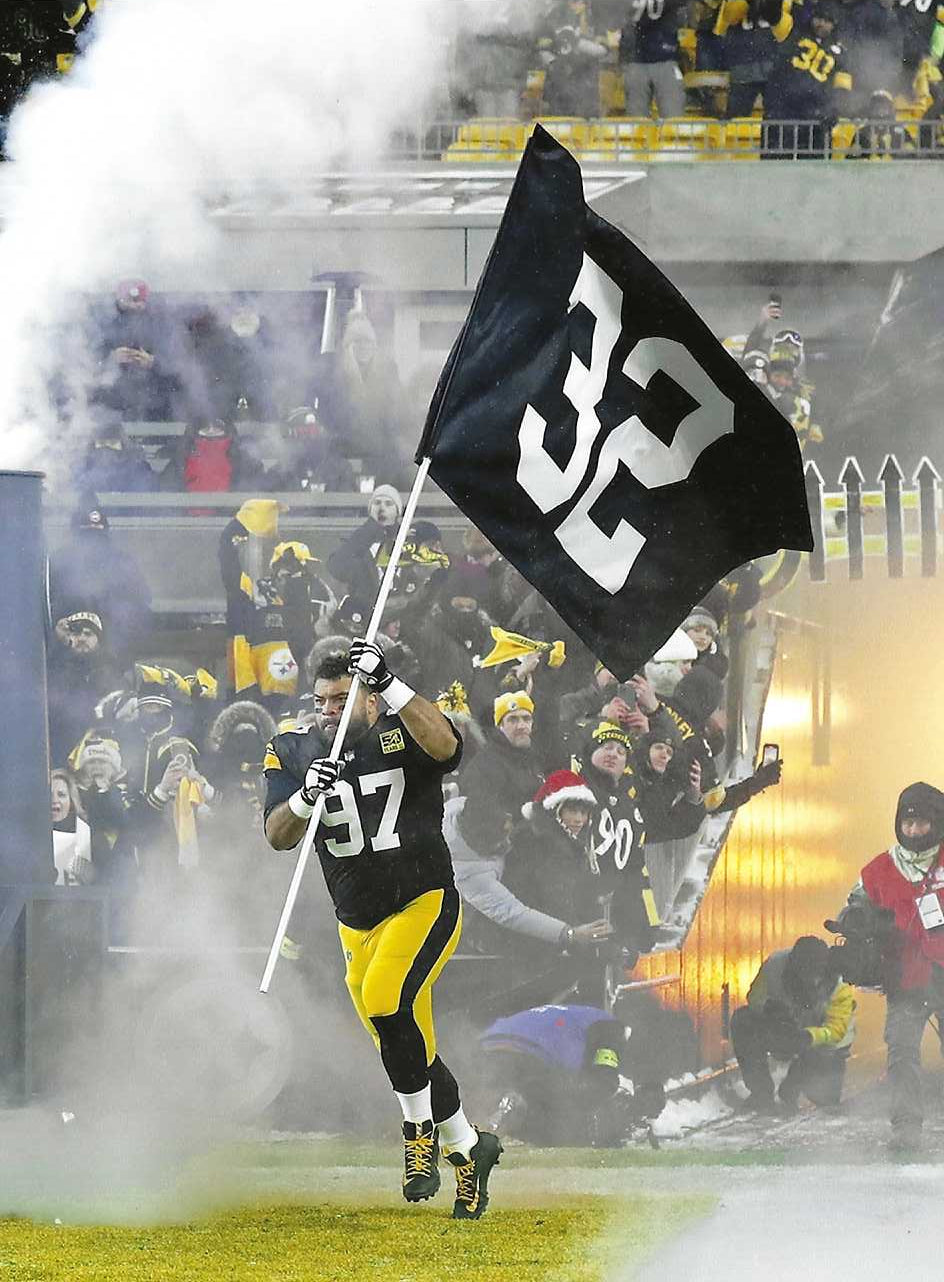 Pittsburgh Steelers Cameron Heyward Carries Franco Harris Flag for the 50th Anniversary of the Immaculate Reception 8x10 Photograph