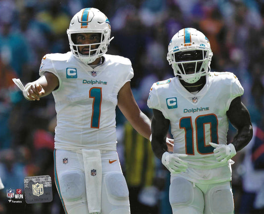 Miami Dolphins Tua Tagovailoa And Tyreek Hill Share a moment On The Field 8x10 Photo Picture